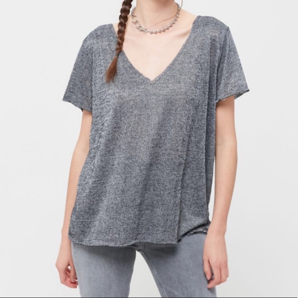 light grey tee can fit up to medium worn once